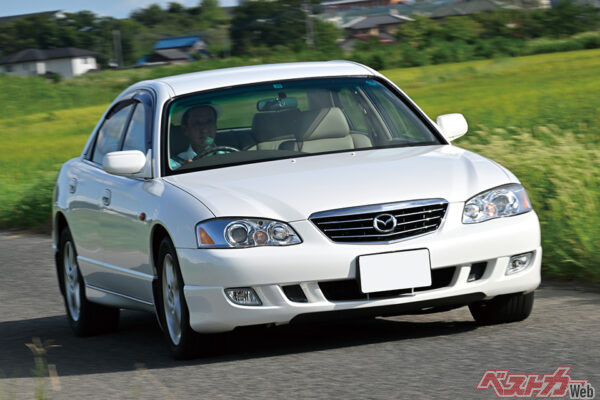 マツダ ミレーニア、2001年の後期モノ2L・V6エンジン搭載の20Mプレミアムエディション、車両本体価格60万円でコミコミ69.9万円。これで本革シート付きだから安い！